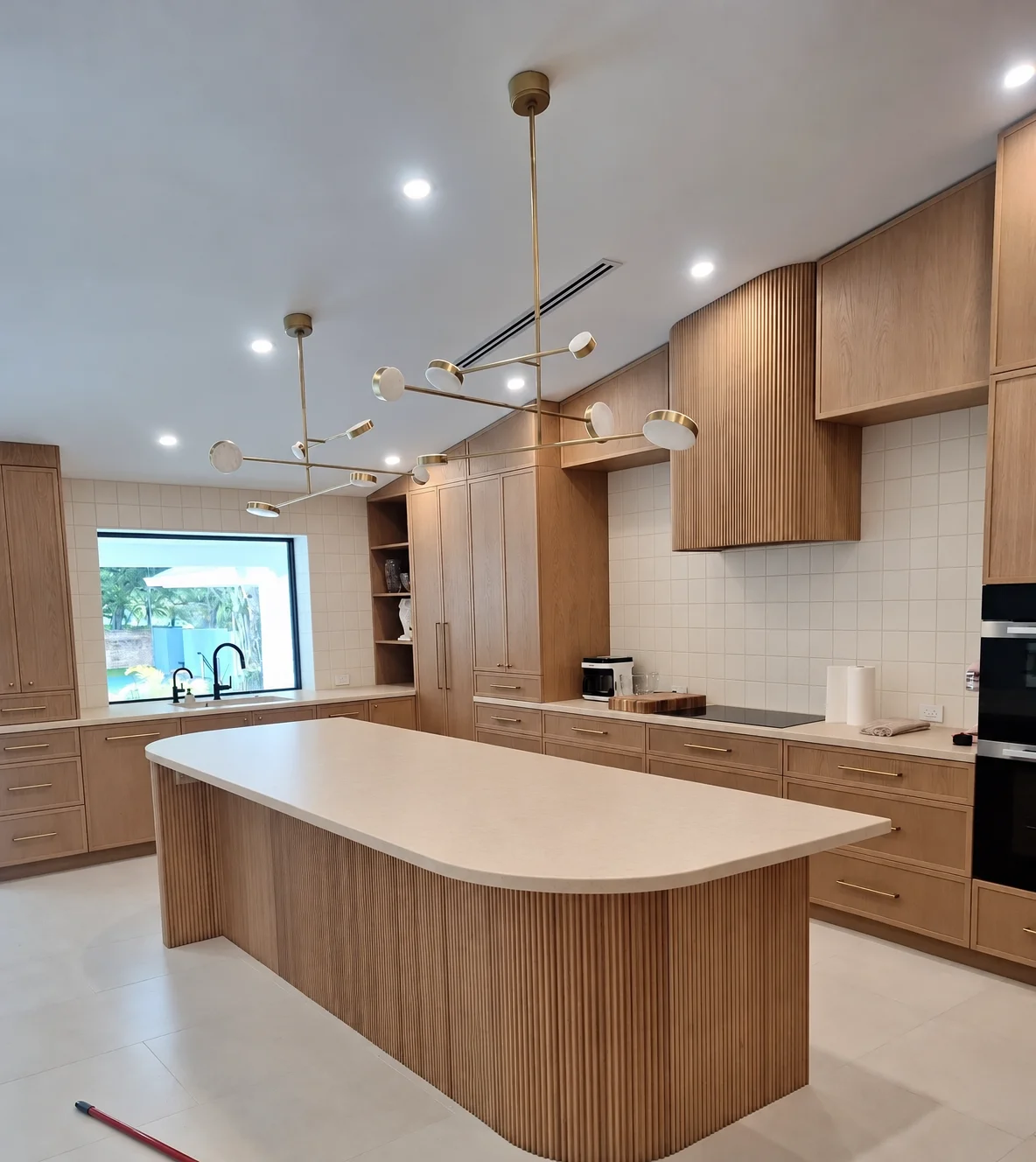AI illustration of the same view with plain beige countertops and a tile backsplash